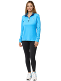 A woman wearing a vibrant Process Blue women's Bar Harbor quarter zip pullover with a navy blue interior collar detail.