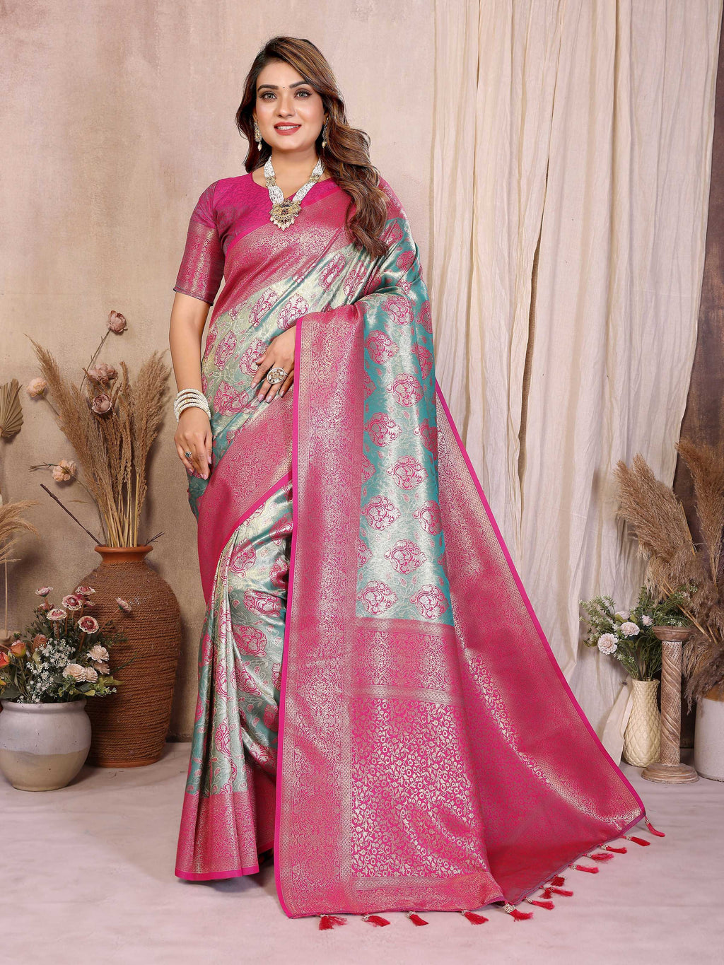 Aastha Fashion Aqua Banarasi Tissue Silk Saree with intricate weaving and a pink blouse