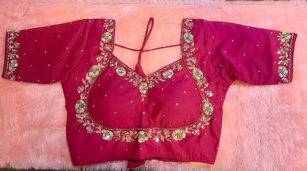 Hot pink silk readymade blouse with intricate zardosi and sequin hand embroidery.