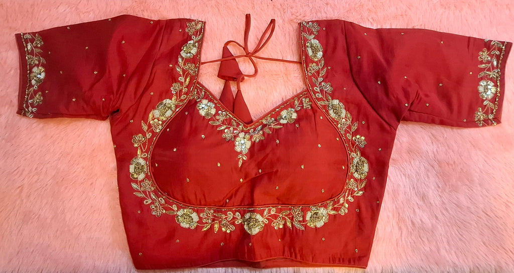 Red silk readymade blouse with intricate zardosi hand embroidery, beads, sequins, and semi-sweetheart neckline