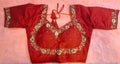 Red silk readymade blouse with intricate zardosi hand embroidery, beads, sequins, and semi-sweetheart neckline