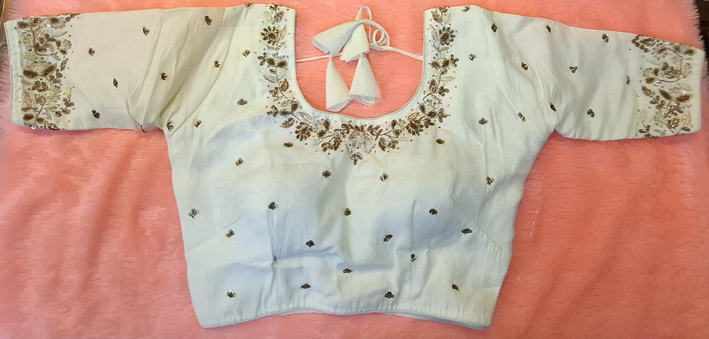 Off-white cotton silk readymade blouse with intricate gold and copper hand embroidery and U-neck