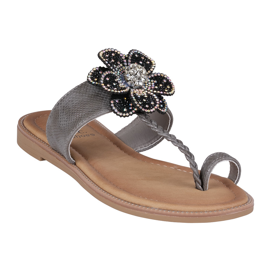 Women's black flat sandals with a floral embellishment and toe ring strap.