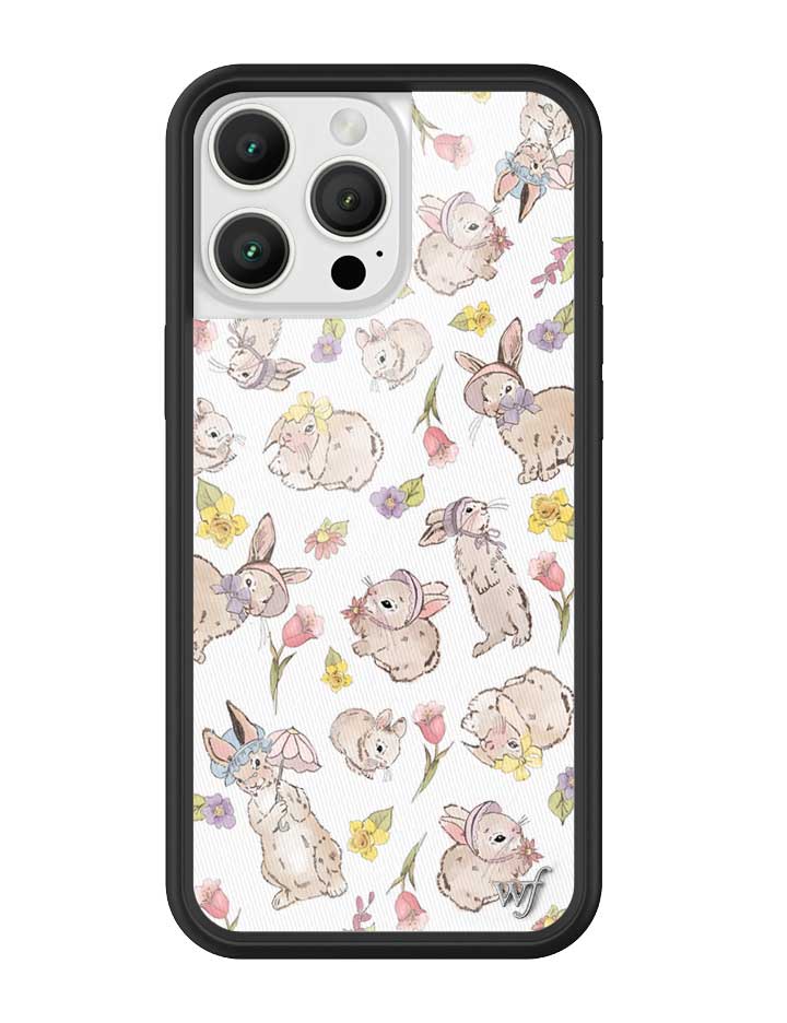 iPhone case with a pattern of bunnies in bonnets and pastel flowers on a white background with a black border.