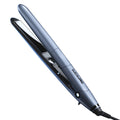 TrueTension 1 inch flat iron in metallic slate blue and matte black on a clean bathroom counter