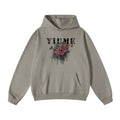 Men wearing a hibiscus blossom print knit hoodie in grey, red, and black colorways