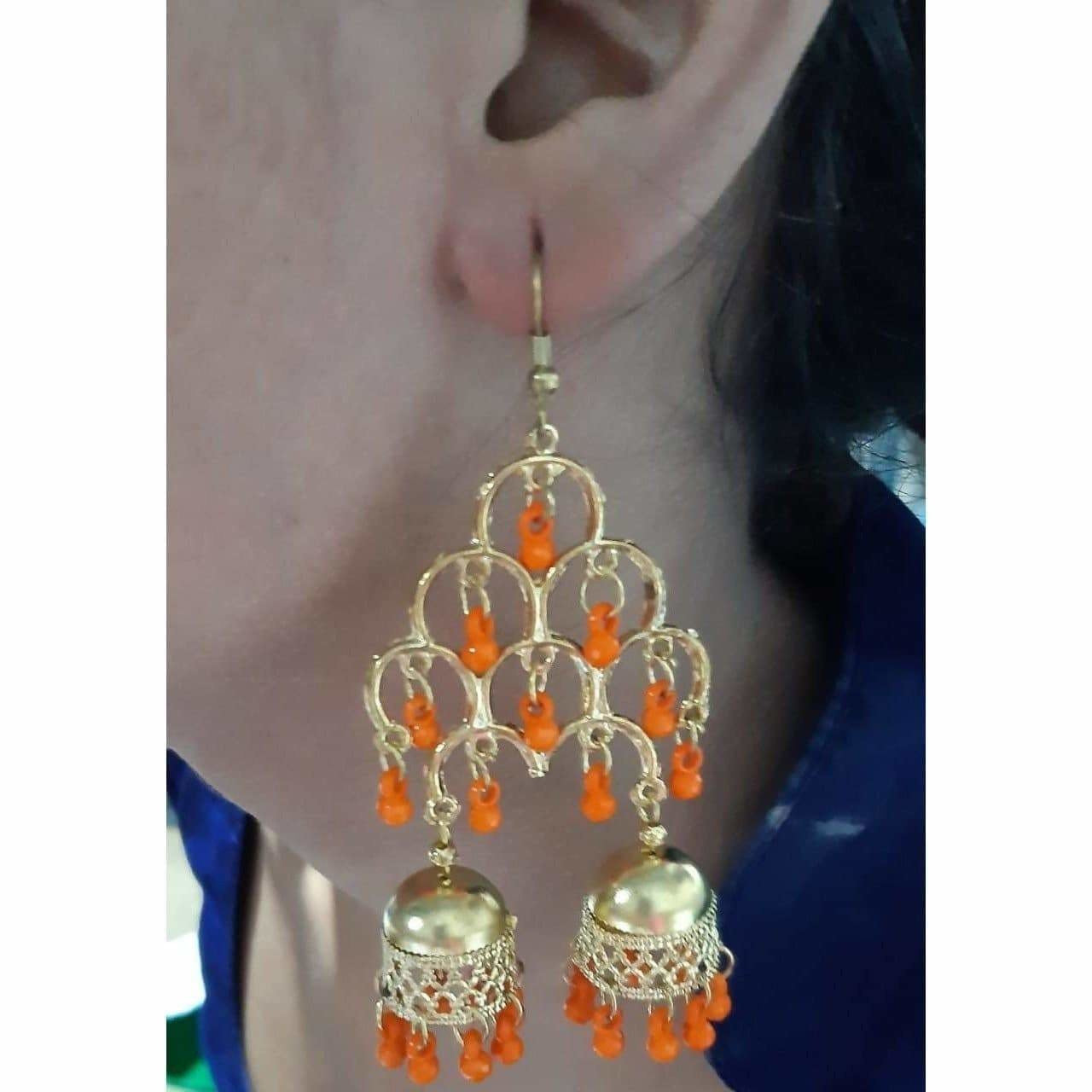 Gold-polished double tier Jhumka earrings with hanging orange pearls