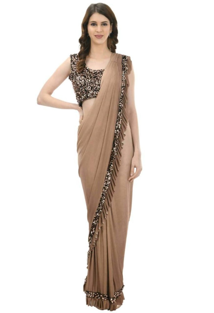 Elegant camel shaded ruffled ready to wear saree draped on a mannequin