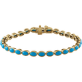 Azuré turquoise line bracelet crafted with natural turquoise stones and 14K yellow gold links.