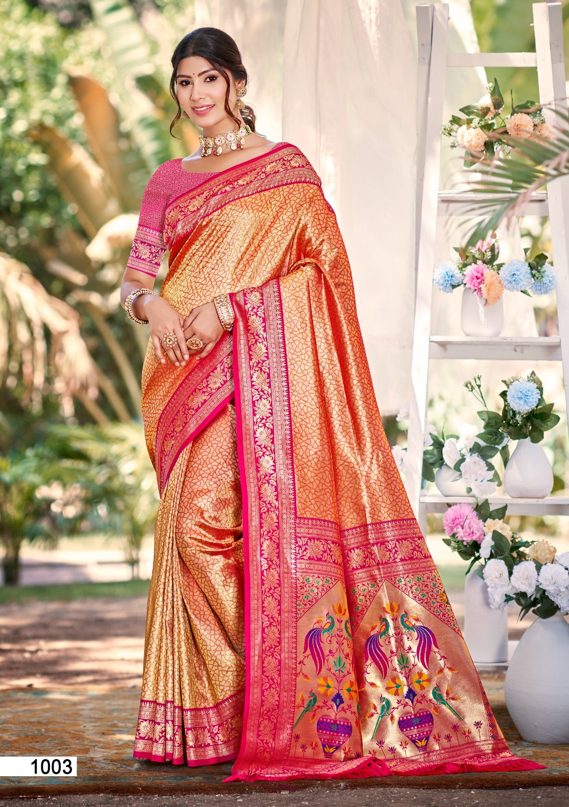 Pink and Orange Kanjivaram silk wedding saree with intricate zari weaving and lace border detail