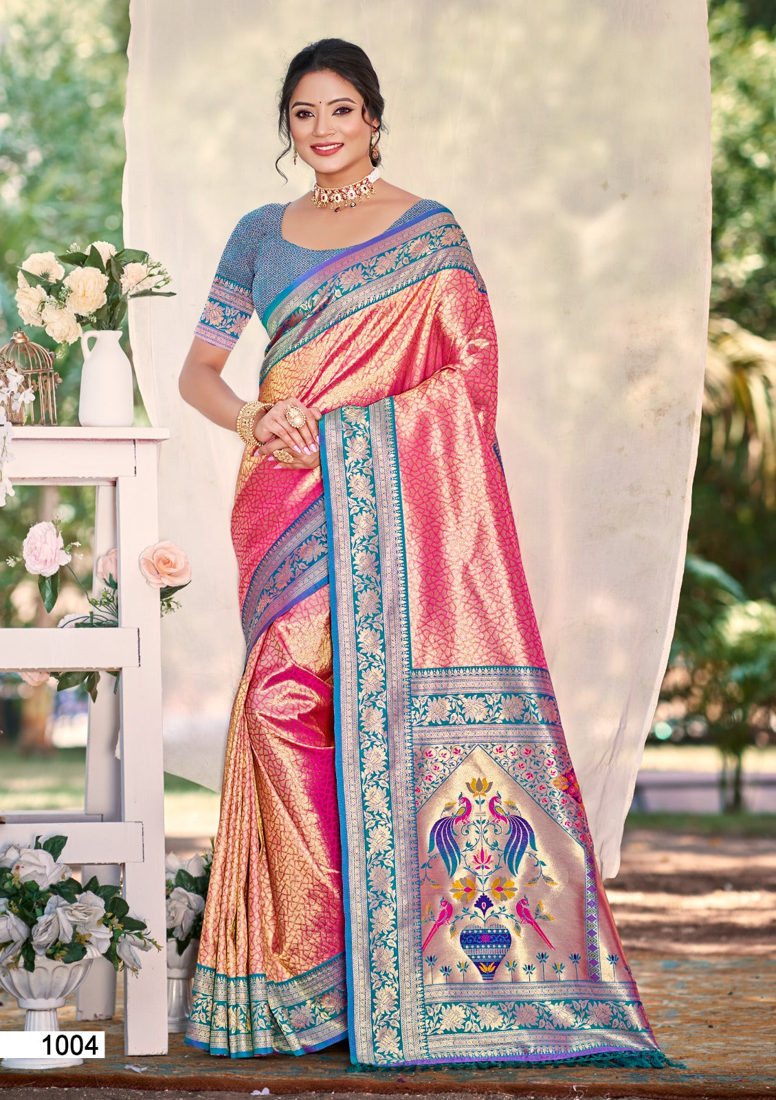 Pink Kanjivaram silk saree with detailed gold zari weaving and lace border