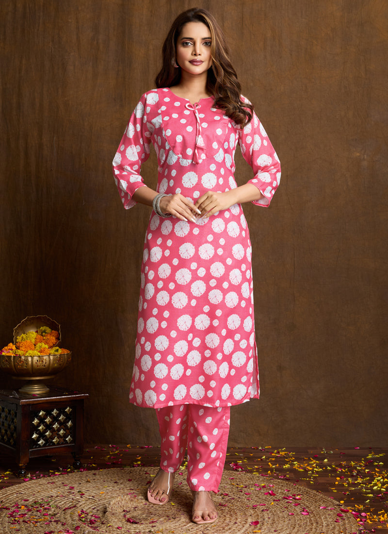 A light pink printed cotton blend kurta and pant set for women.