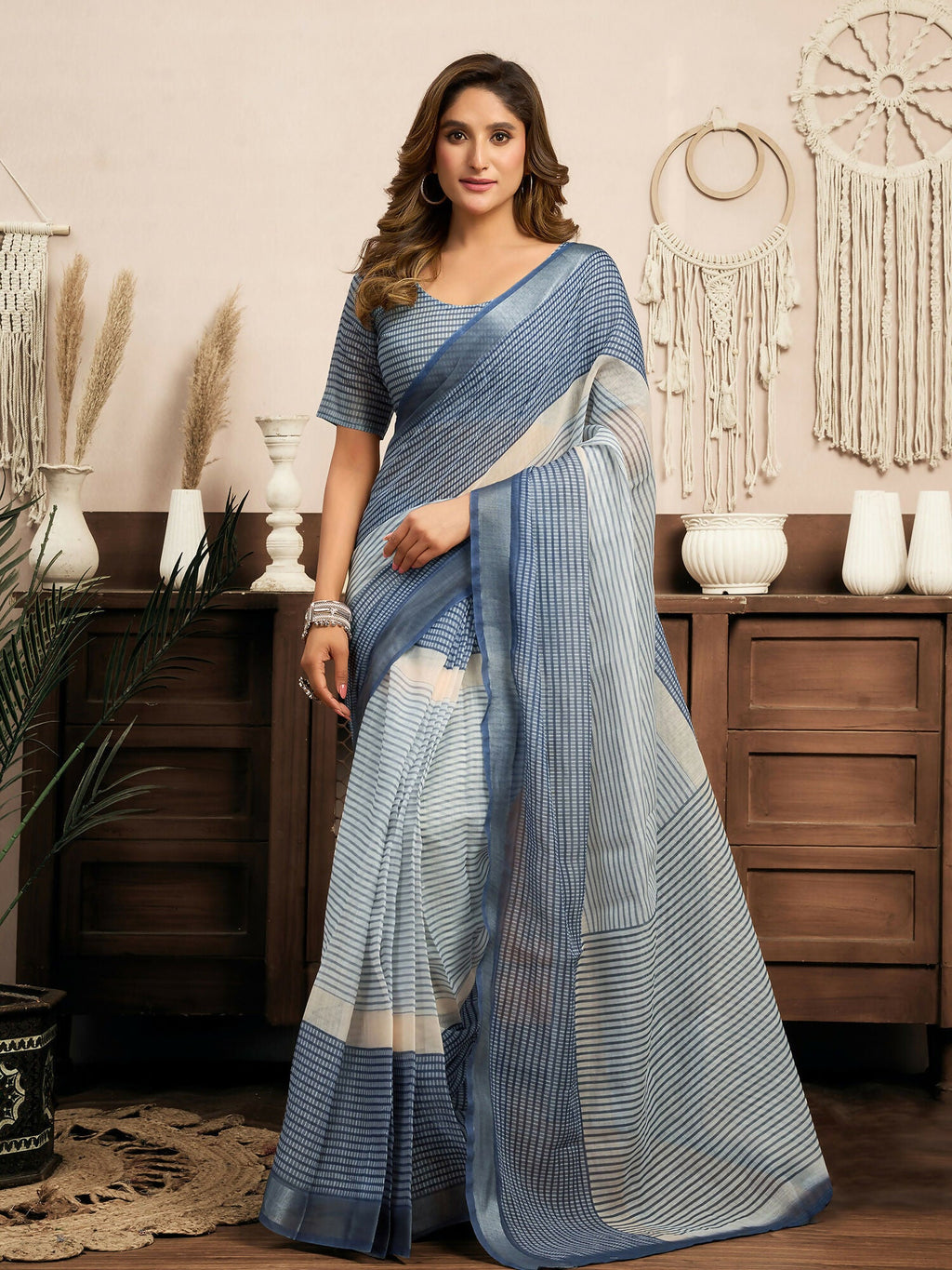 Cream and blue striped linen ready-to-wear saree paired with a navy blue blouse
