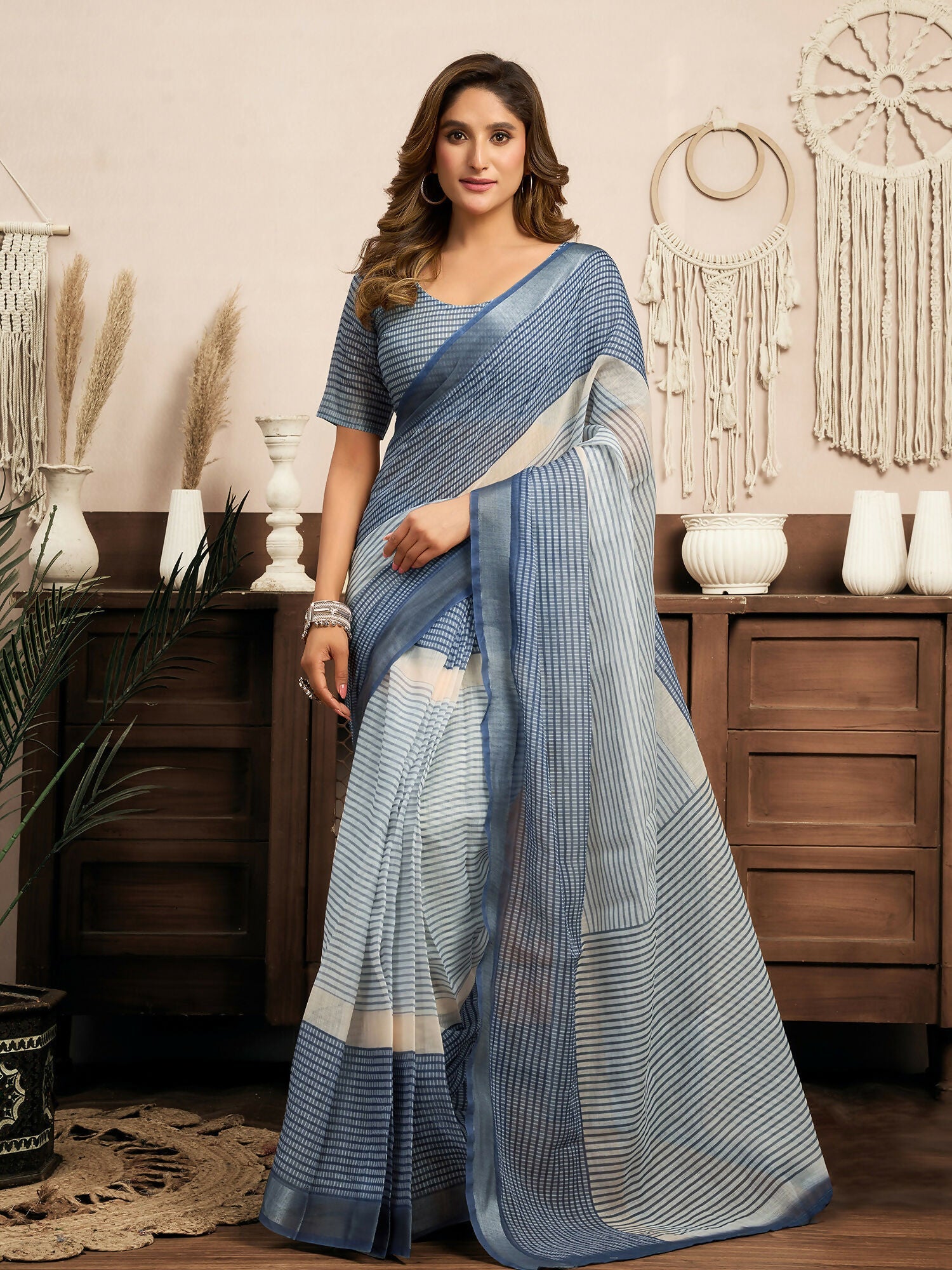 Cream and blue striped linen ready-to-wear saree paired with a navy blue blouse