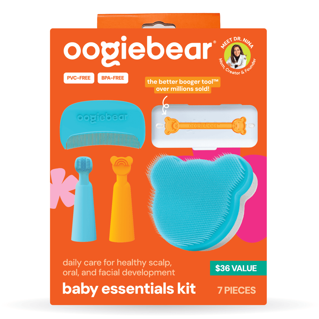 7-piece baby essentials kit in teal, orange, and white, organized for nursery care.