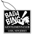 Bada Bing Gentlemen's Club novelty air freshener hanging as a dashboard accessory in a car.