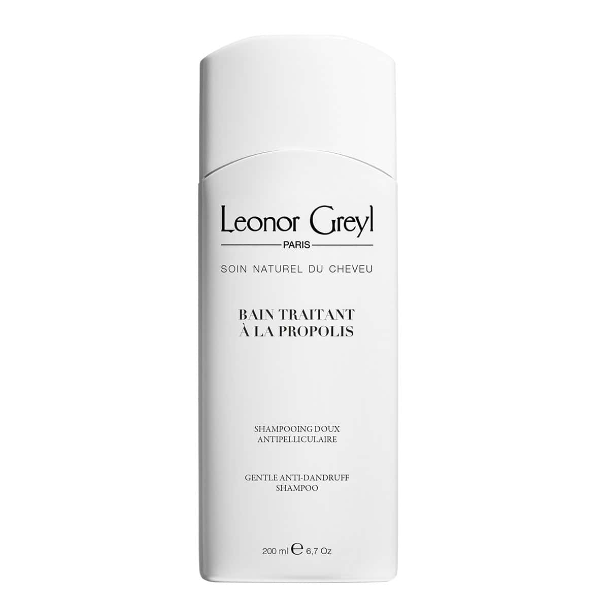 White bottle of Leonor Greyl Bain Traitant à la Propolis, 6.7 oz, professional anti-dandruff hair treatment.