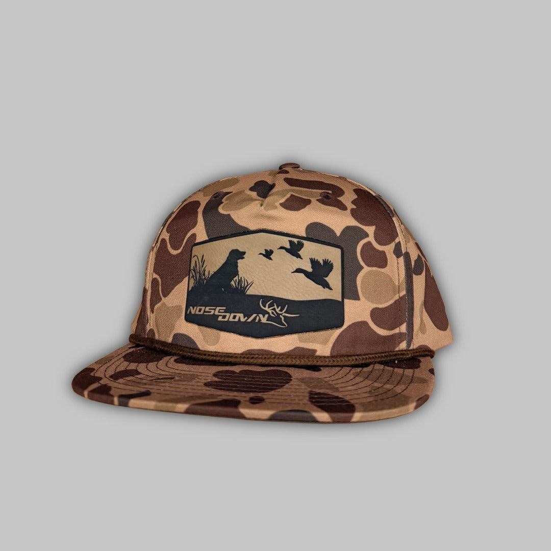 Big Duck Dog camo print rope-style snapback hat for outdoor activities.