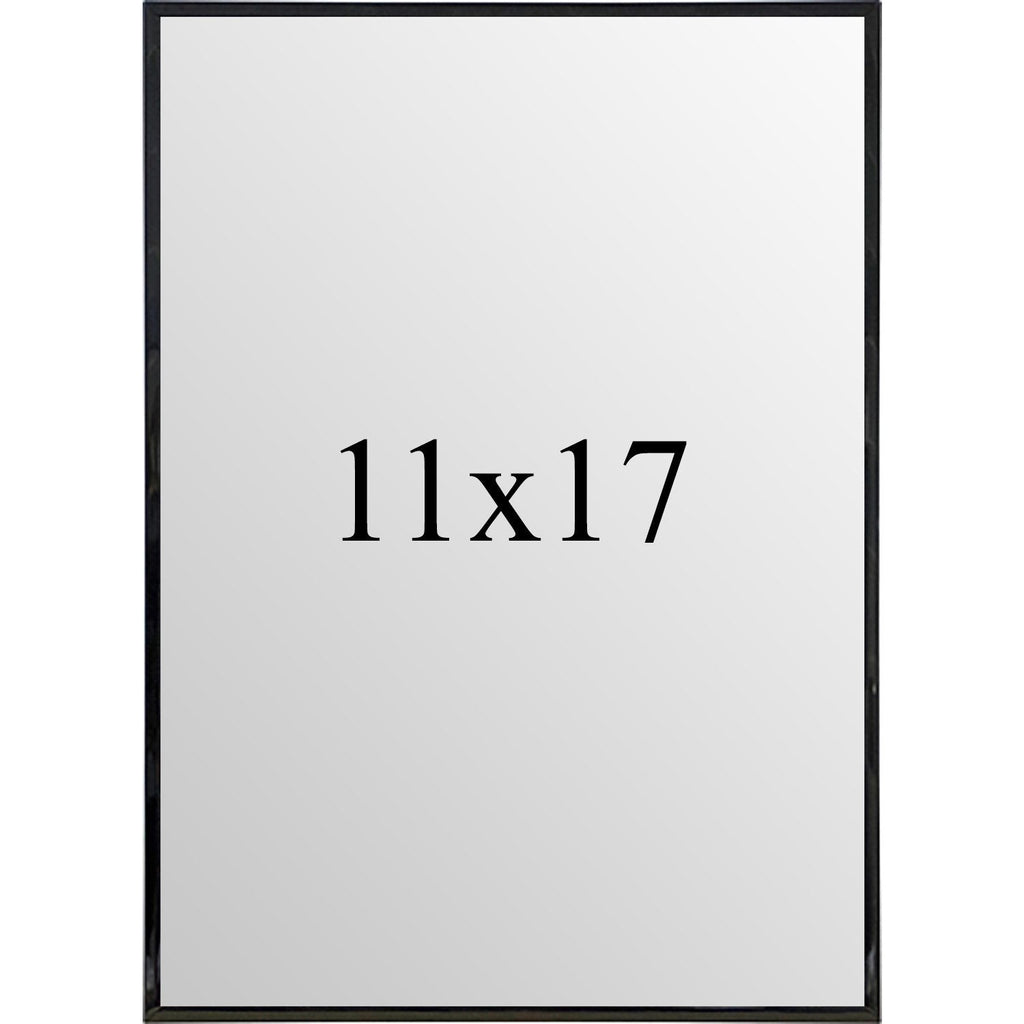 Modern 11x17 black metal poster frame displayed on a gallery wall