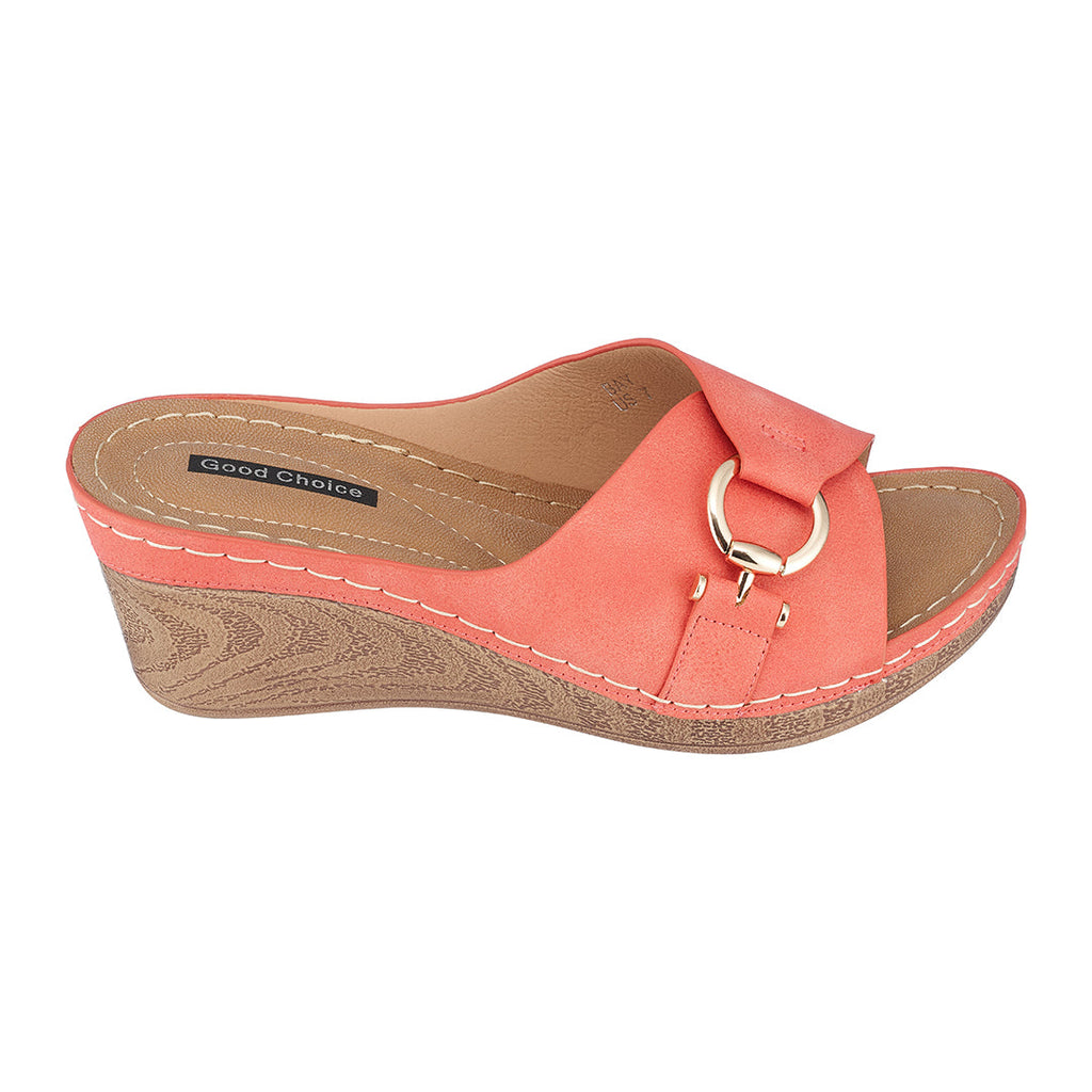 Women's coral wedge sandals featuring an open-toe design and comfortable heel.