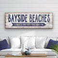 Personalized nautical beach sign with navy typography and directional arrow on weathered white wood background