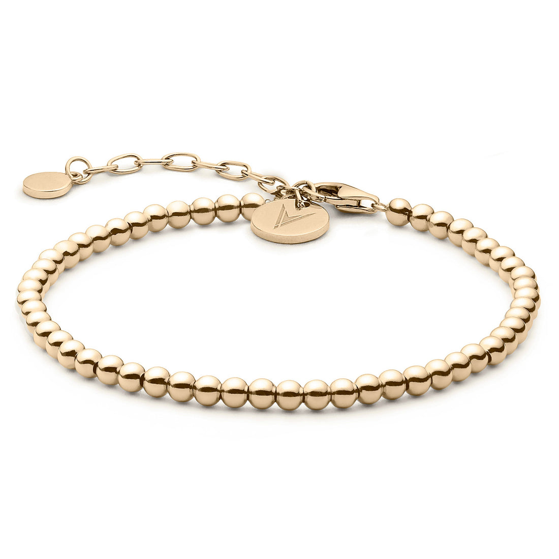 Close up of The Beaded Bracelet in 14K gold plated sterling silver on a neutral background.