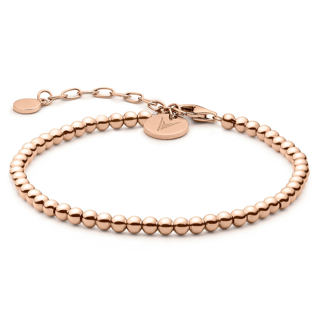 Elegant rose gold beaded bracelet featuring a sterling silver base and adjustable clasp.