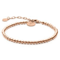 Elegant rose gold beaded bracelet featuring a sterling silver base and adjustable clasp.