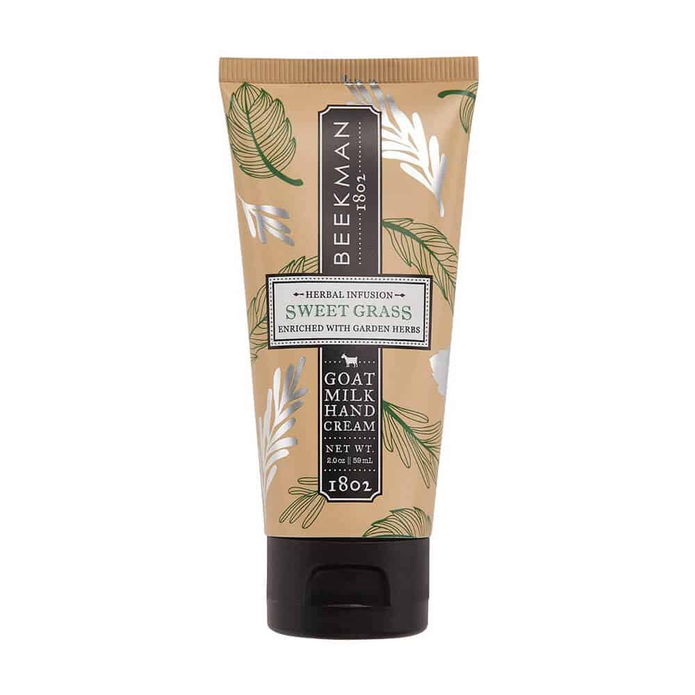 A 2 oz tube of Beekman 1802 Sweet Grass Goat Milk Hand Cream featuring botanical packaging.