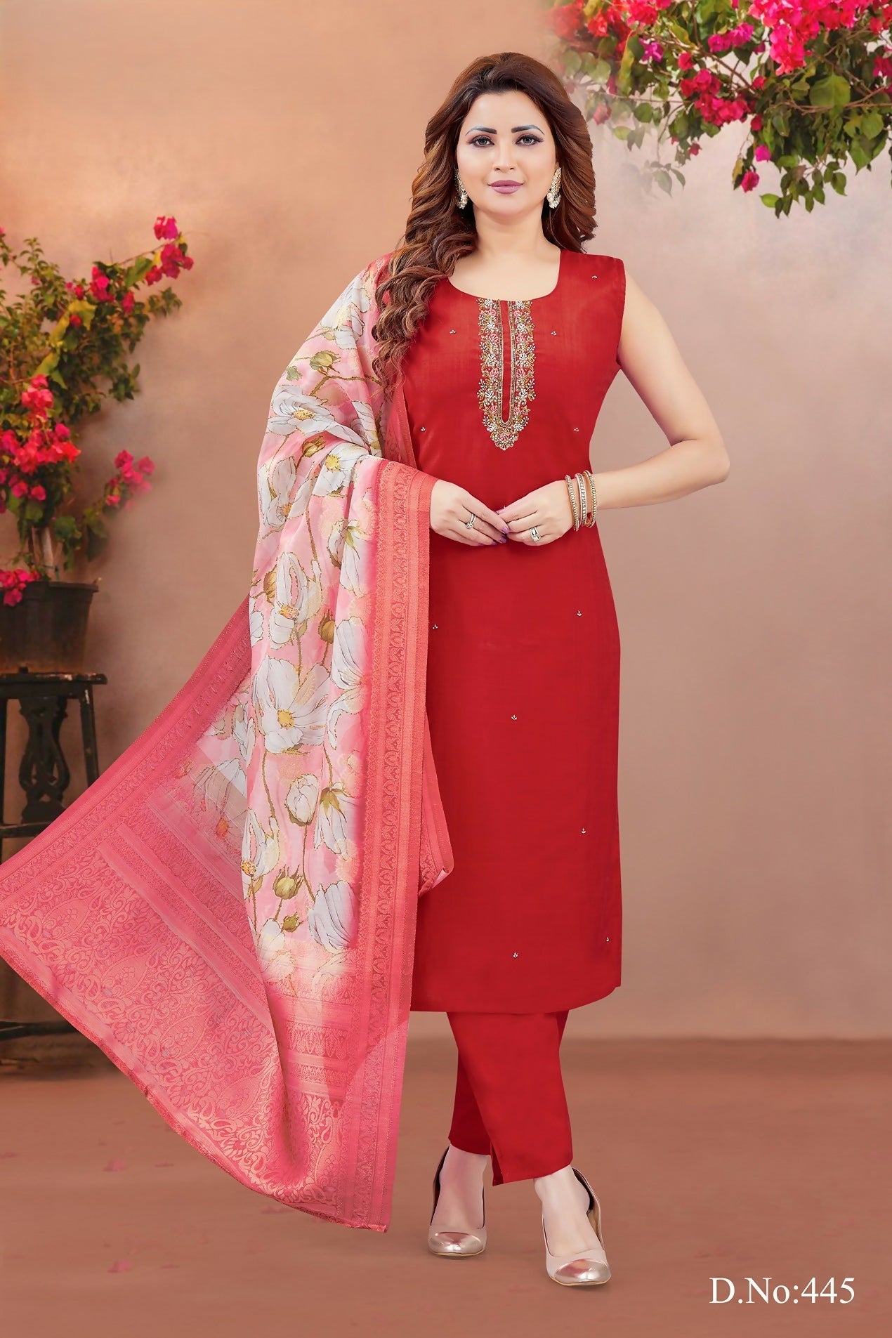 A beautiful red soft silk kurta set featuring embroidery and a round neckline