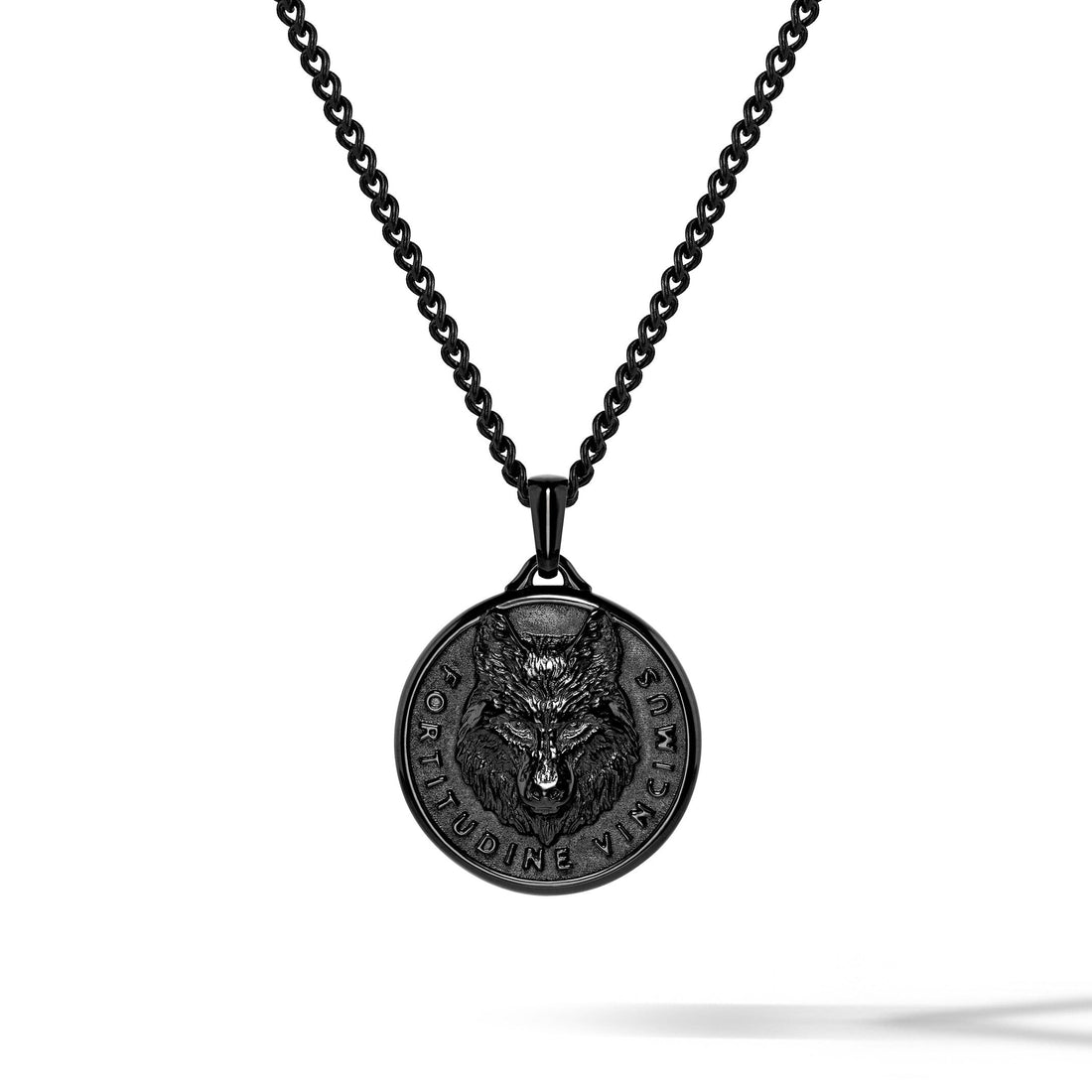 The Wolf pendant in stealth matte, featuring detailed wolf head carving.
