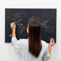 Black world map canvas wall art with modern minimalist aesthetic