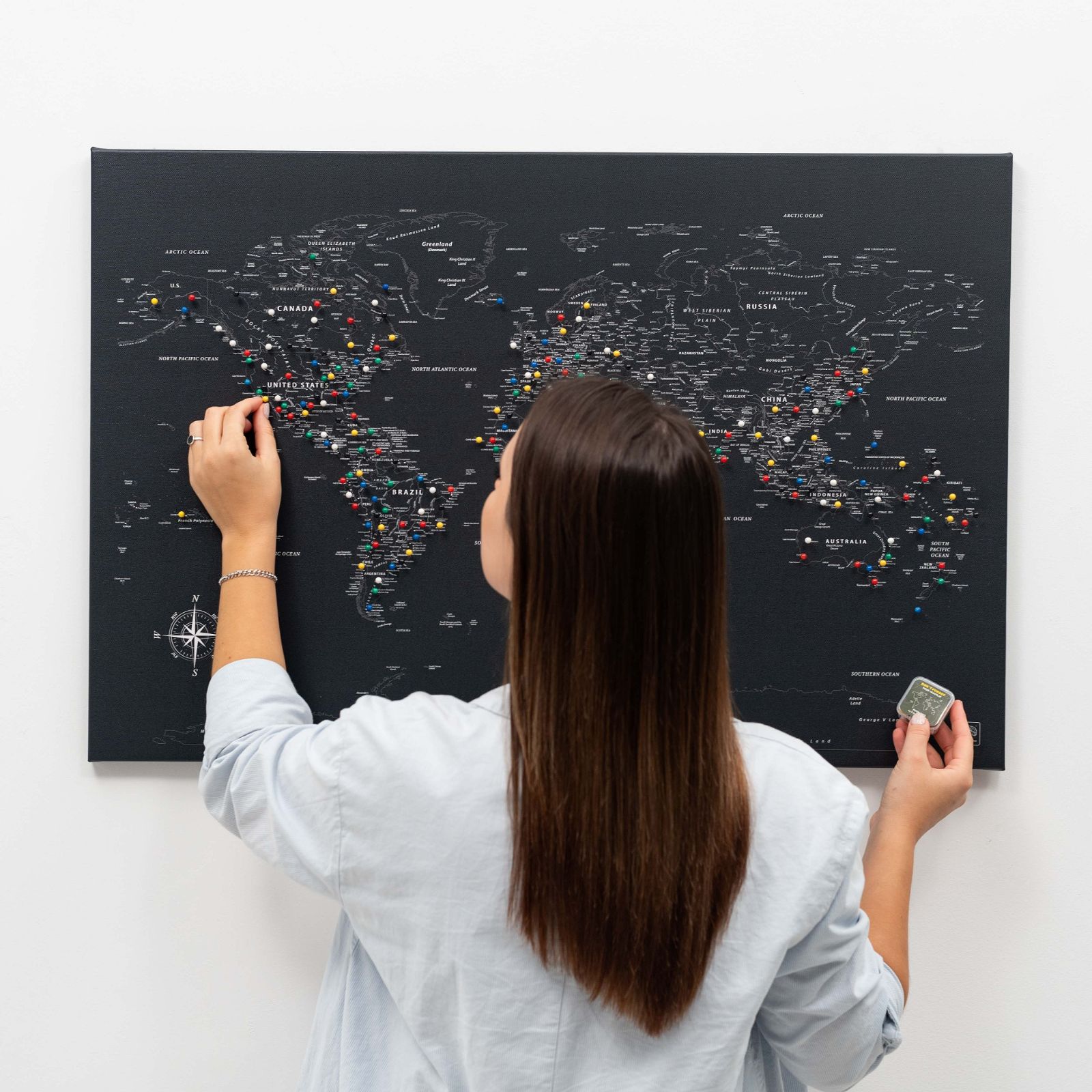 Black world map canvas wall art with modern minimalist aesthetic