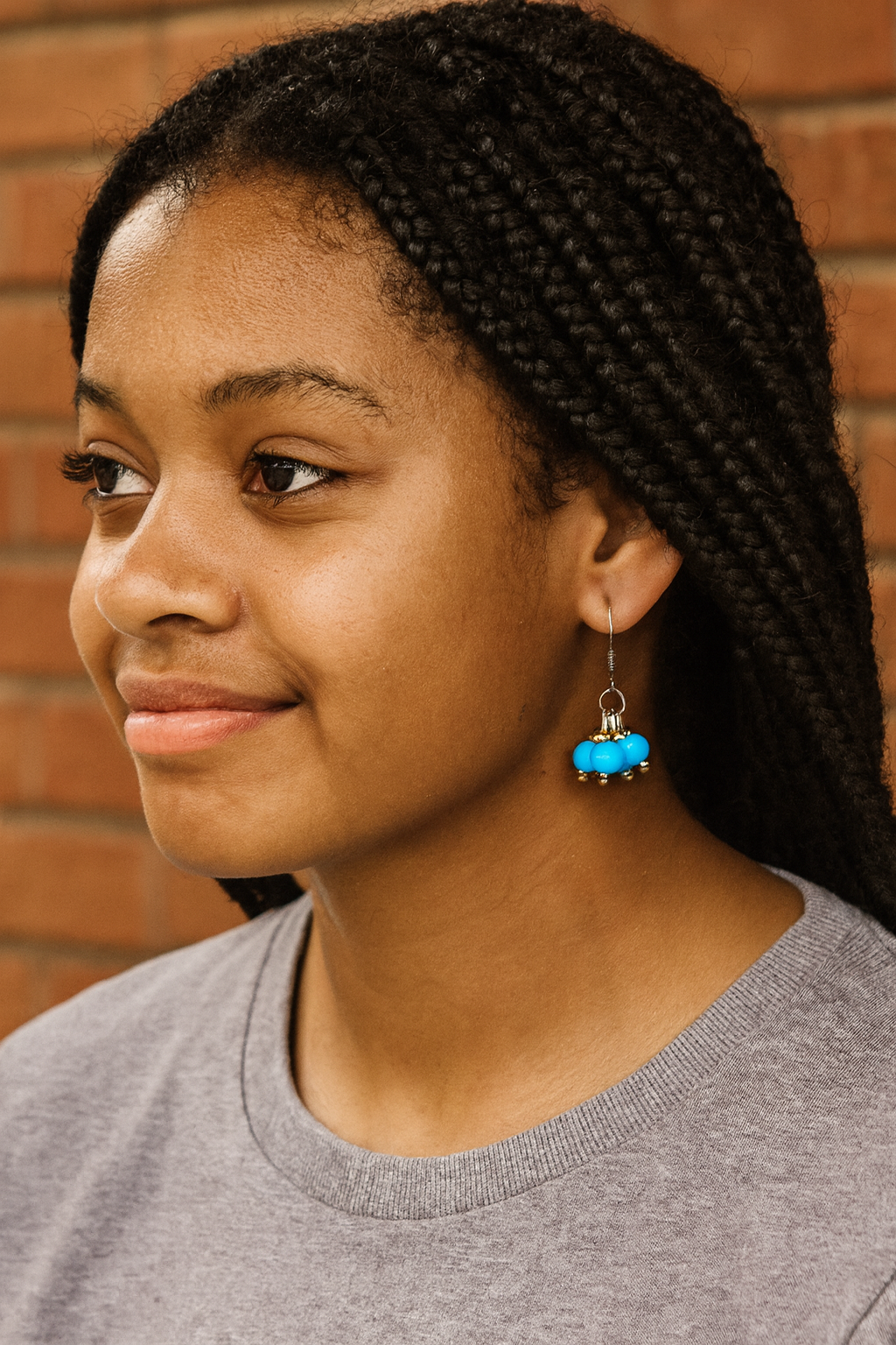 Tooro Tassel Earrings featuring multi-colored Ugandan paper beads and gold spacer beads