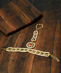 Traditional red and gold Kundan Hathphool bracelet, handcrafted brass accessory for Indian weddings