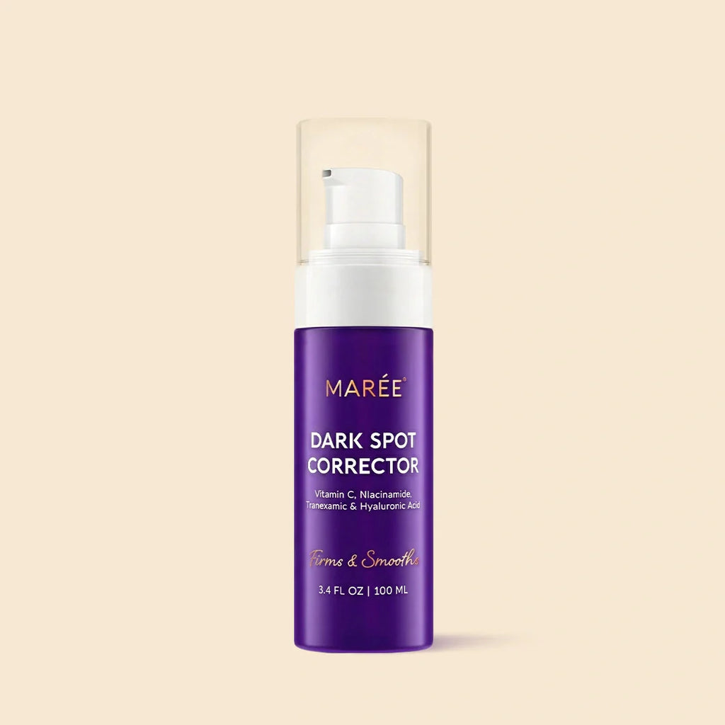 Purple pump bottle of Marée Dark Spot Corrector for face and body showing key ingredients Vitamin C, Niacinamide, and Hyaluronic Acid.