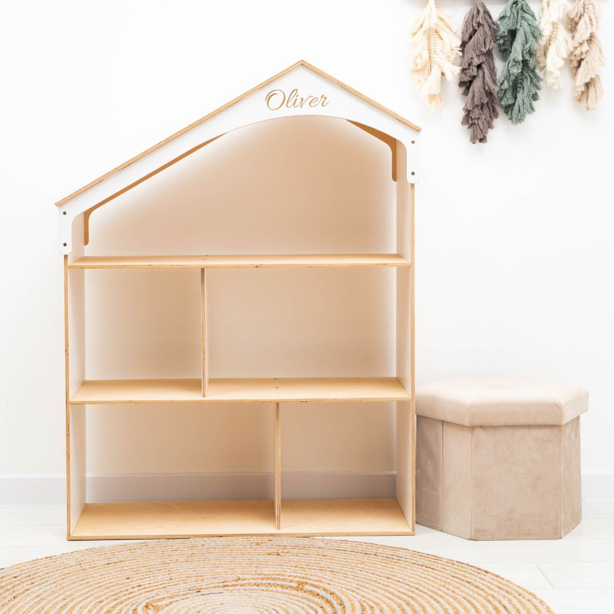 White dollhouse-shaped bookcase for children's room storage and play