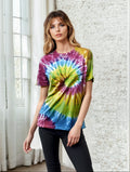 Model wearing a vibrant multi-colored spiral tie dye crew neck t-shirt.