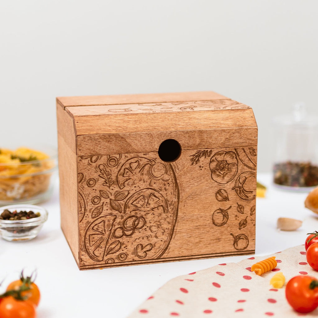 Wooden recipe box with pizza-themed engraving on a kitchen counter