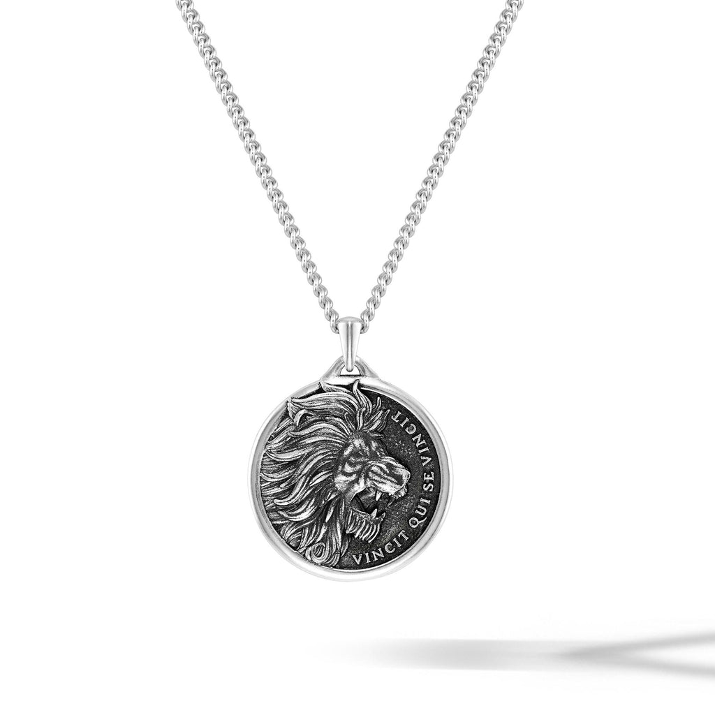 Sterling Silver Lion pendant featuring detailed engraving on a metallic background