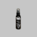 2oz bottle of Bully Buck 100% pure whitetail buck urine in a black bottle with white text.