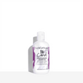 Bumble and bumble Curl Moisturizing Shampoo in a minimalist white bottle with a purple abstract brush-stroke design.