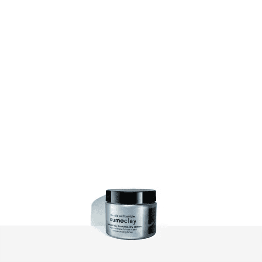 Bumble and bumble Sumoclay 1.5 OZ jar in metallic silver with a black cap on a neutral background.