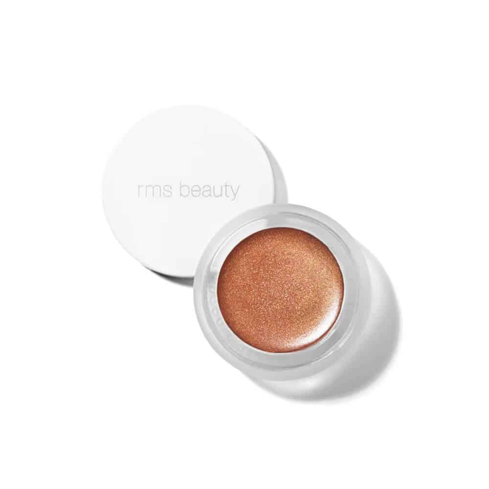 Close up of RMS Buriti Bronzer in a small glass pot showing the creamy, warm-toned bronzing product.