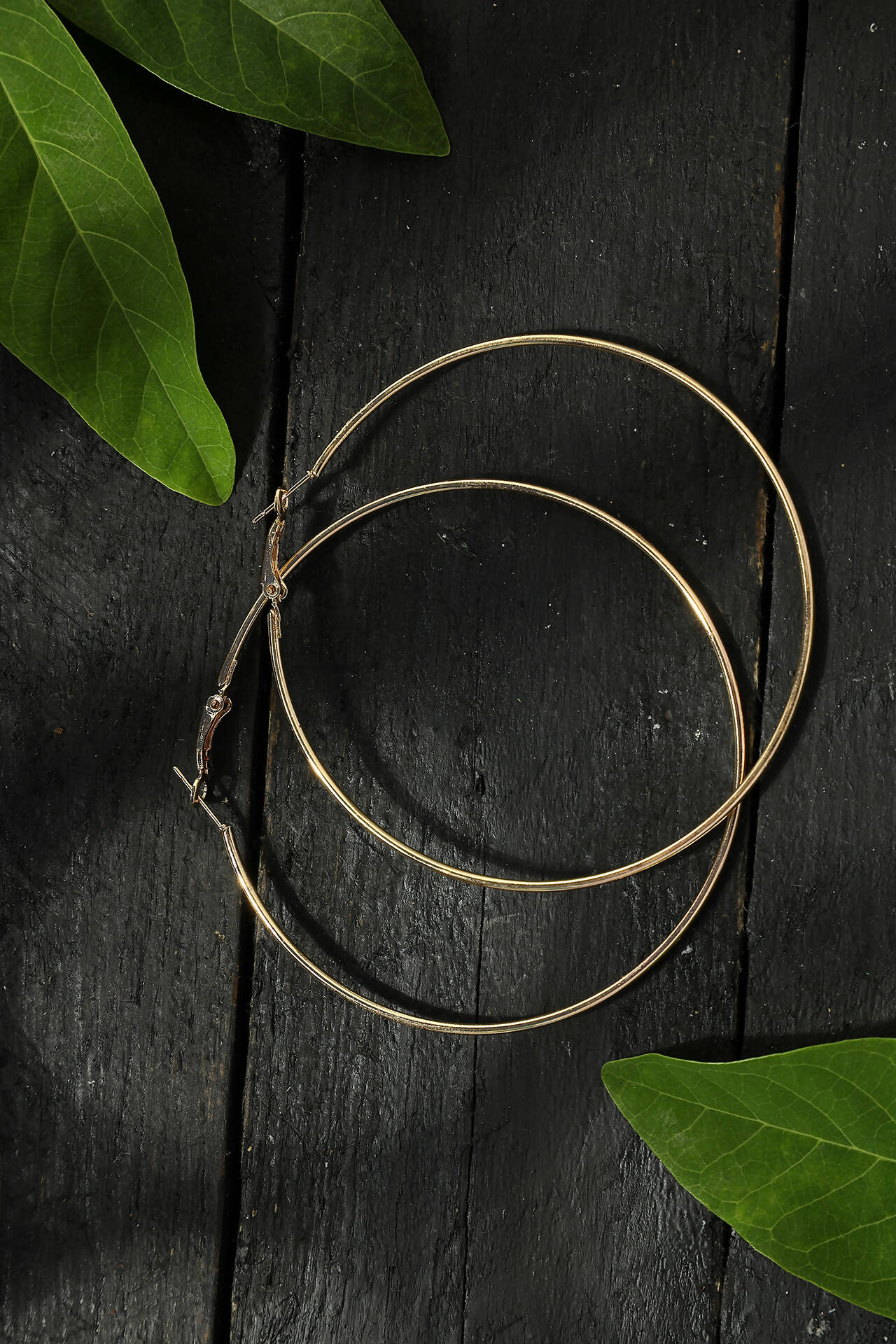 Elegant gold-polished drop earrings for women with a sleek, minimalist design
