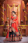 Black Art Silk lehenga with a vibrant red blouse and matching dupatta for Navratri.