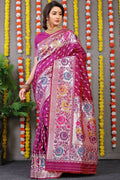 Magenta Banarasi Silk saree with intricate gold zari woven details and matching blouse