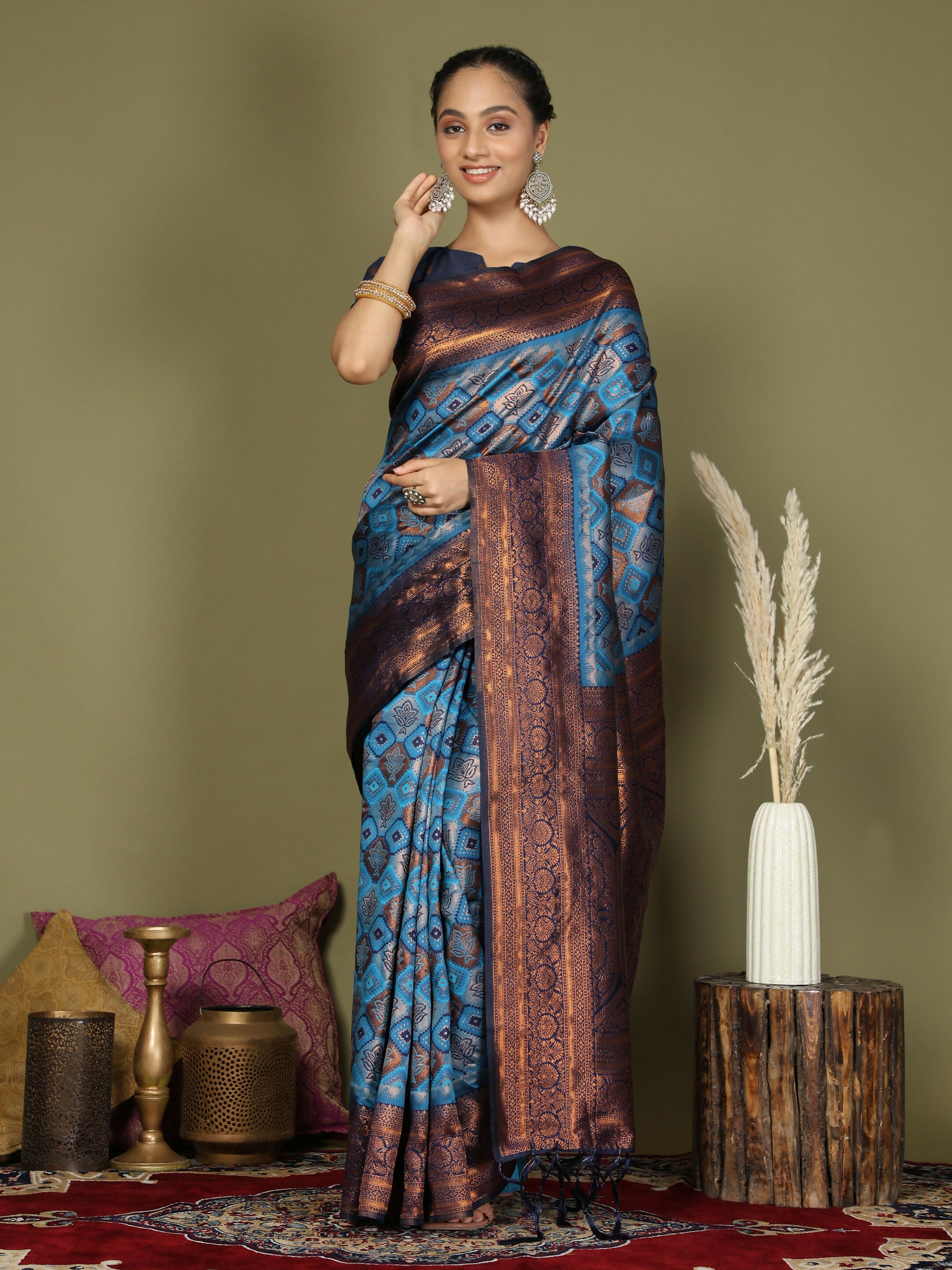 Sky Blue Lichi Silk saree with a coordinated blue blouse.