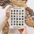 Close up of decorative Italy Landmarks pins displayed on a wooden travel map