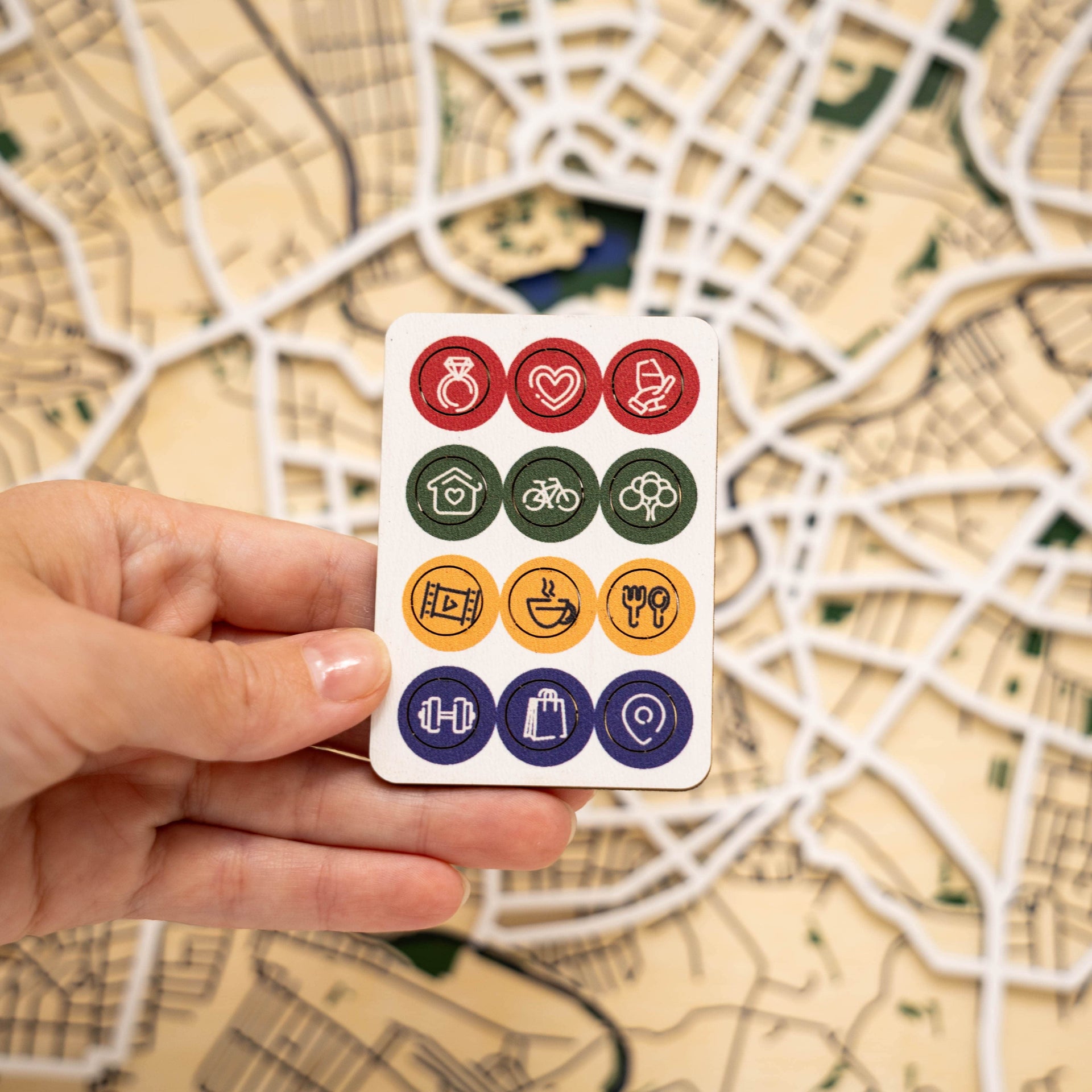 Set of Wooden Map Pins featuring lifestyle icons like cafes and gyms for use on a wooden travel map.